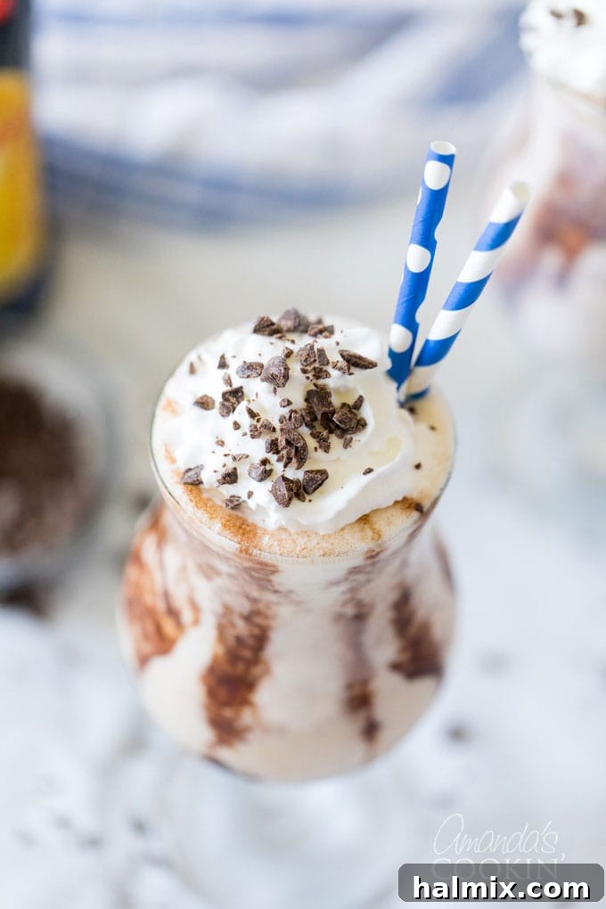 hurricane glass with mudslide and two straws