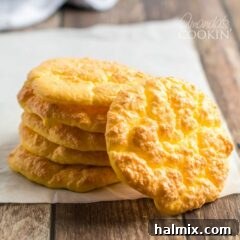 Stack of cloud bread discs, golden brown and fluffy, showcasing the perfect texture for a keto and low-carb bread alternative.