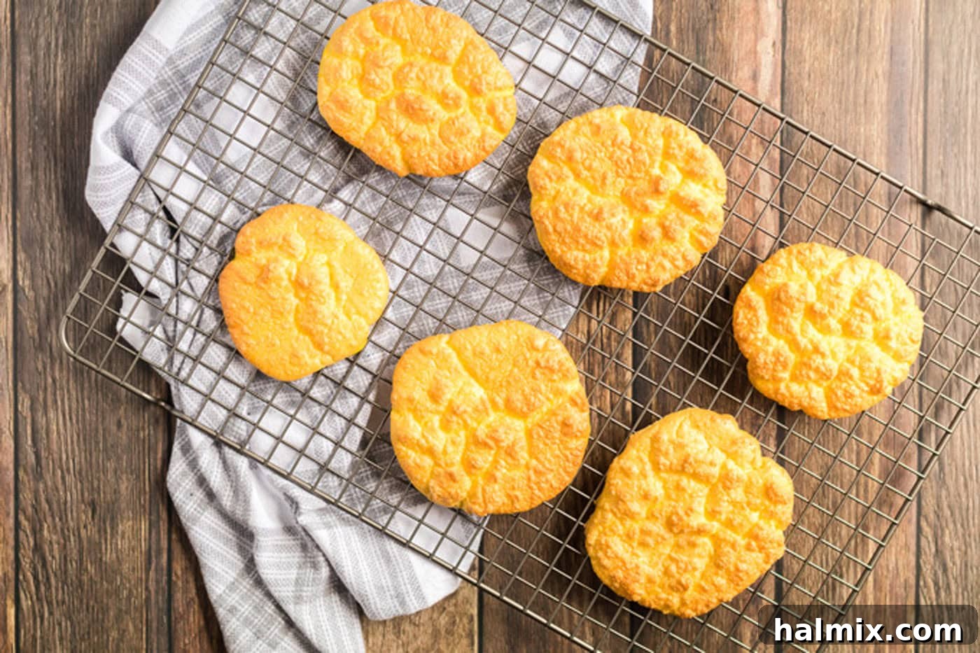 Pillowy Cloud Bread 9 Freshly baked cloud bread cooling on a wire rack, achieving a perfect texture
