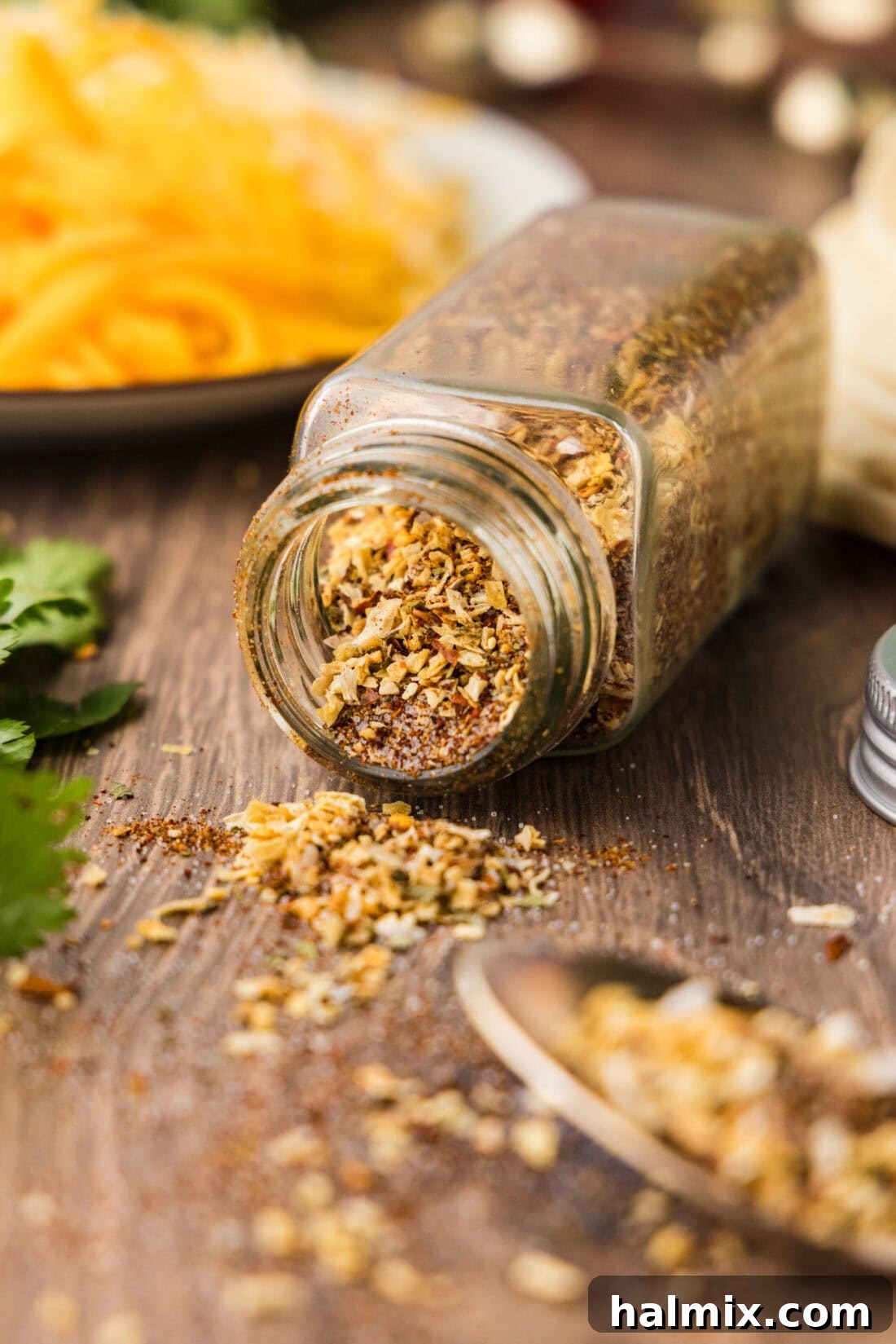 homemade taco seasoning in a jar that fell over and is spilling out