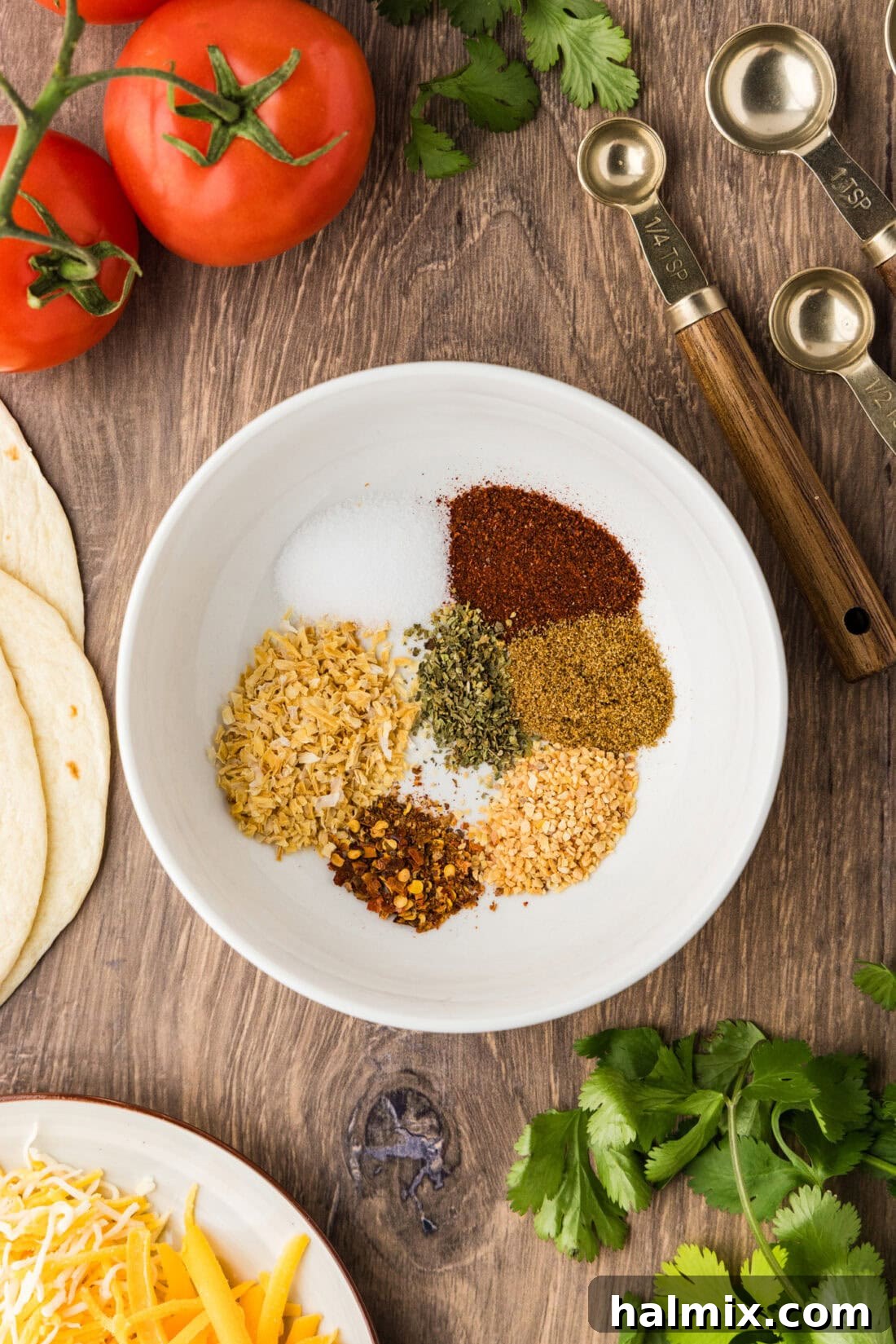 white bowl with ingredients for making taco seasoning