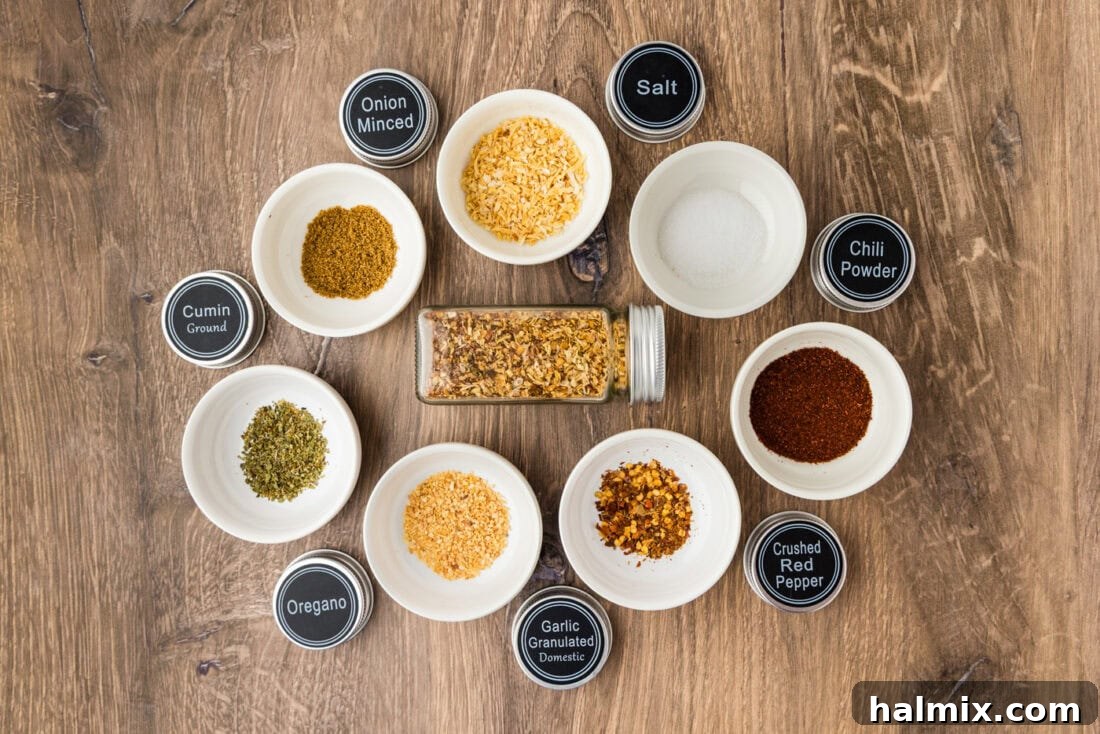 ingredients for taco seasoning mix in small white bowls
