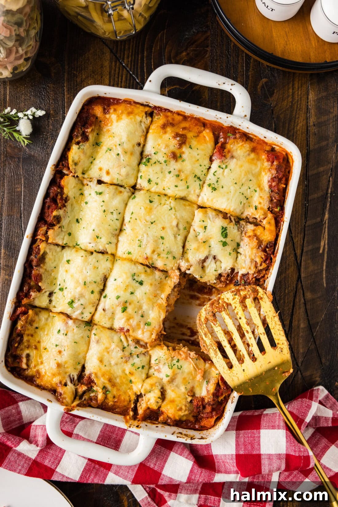 Classic Italian Lasagna 2 Pan of Italian Lasagna cut into squares with a slice removed