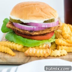 A close-up of a finished Iowa pork tenderloin sandwich, ready to be enjoyed.
