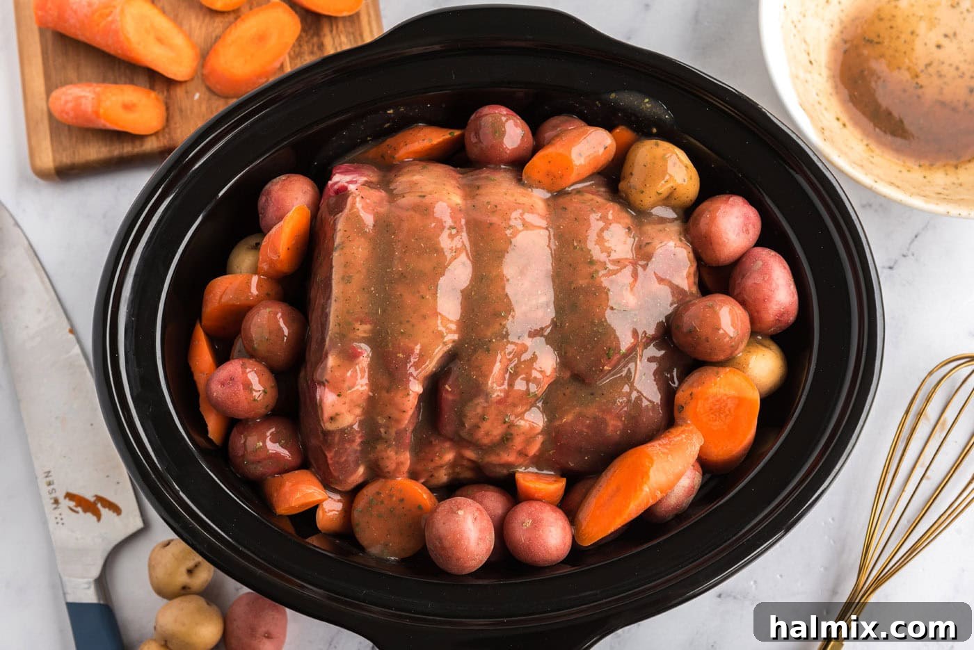 Perfect Slow Cooker Pot Roast 10 gravy poured over crockpot roast beef
