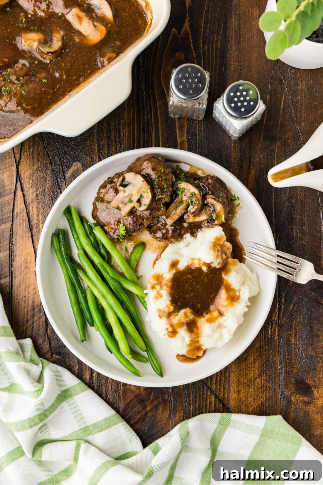 Hearty Salisbury Steaks 12 A perfectly plated Salisbury steak dinner with gravy, ready to be enjoyed, showcasing a comforting meal.