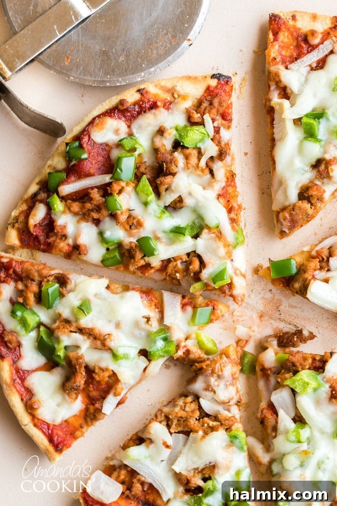 Pizza sausage is super easy to make and tastes delicious. It's similar to Italian sausage, so you can serve as patties as well. Homemade pizza is the best! #homemadepizza #pizzasausage #pizzasausagerecipe #howtomakepizza #howtomakesausagepizza #pizzarecipe #italiansausagerecipe #amandascookin slices of homemade pizza with sausage and green pepper