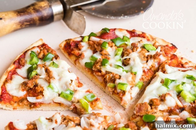 Crafting Delicious Homemade Pizza Sausage 5 pizza sliced with a pizza wheel in background