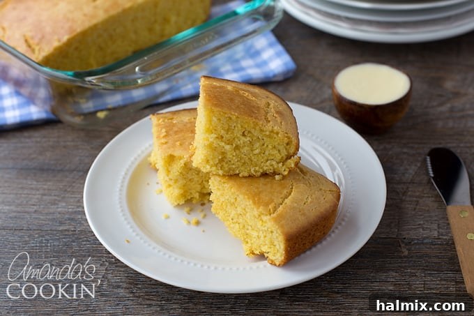 Delicious Sweet Cornbread 6 A close-up shot of a square of golden sweet cornbread, perfectly baked, presented alongside a bowl of rich, homemade chili, promising a delicious comfort food experience.