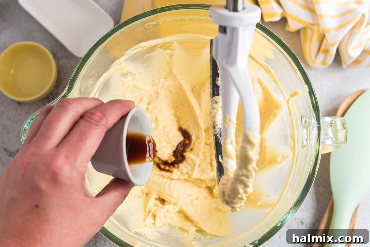 Harvest Pumpkin Chocolate Chip Muffins 11 pouring vanilla into butter and sugar mixture