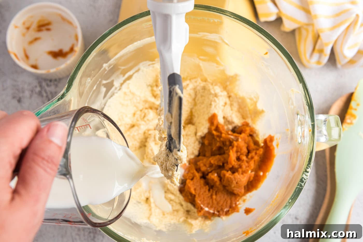 Harvest Pumpkin Chocolate Chip Muffins 12 adding pumpkin puree and buttermilk to butter mixture in a bowl for muffins
