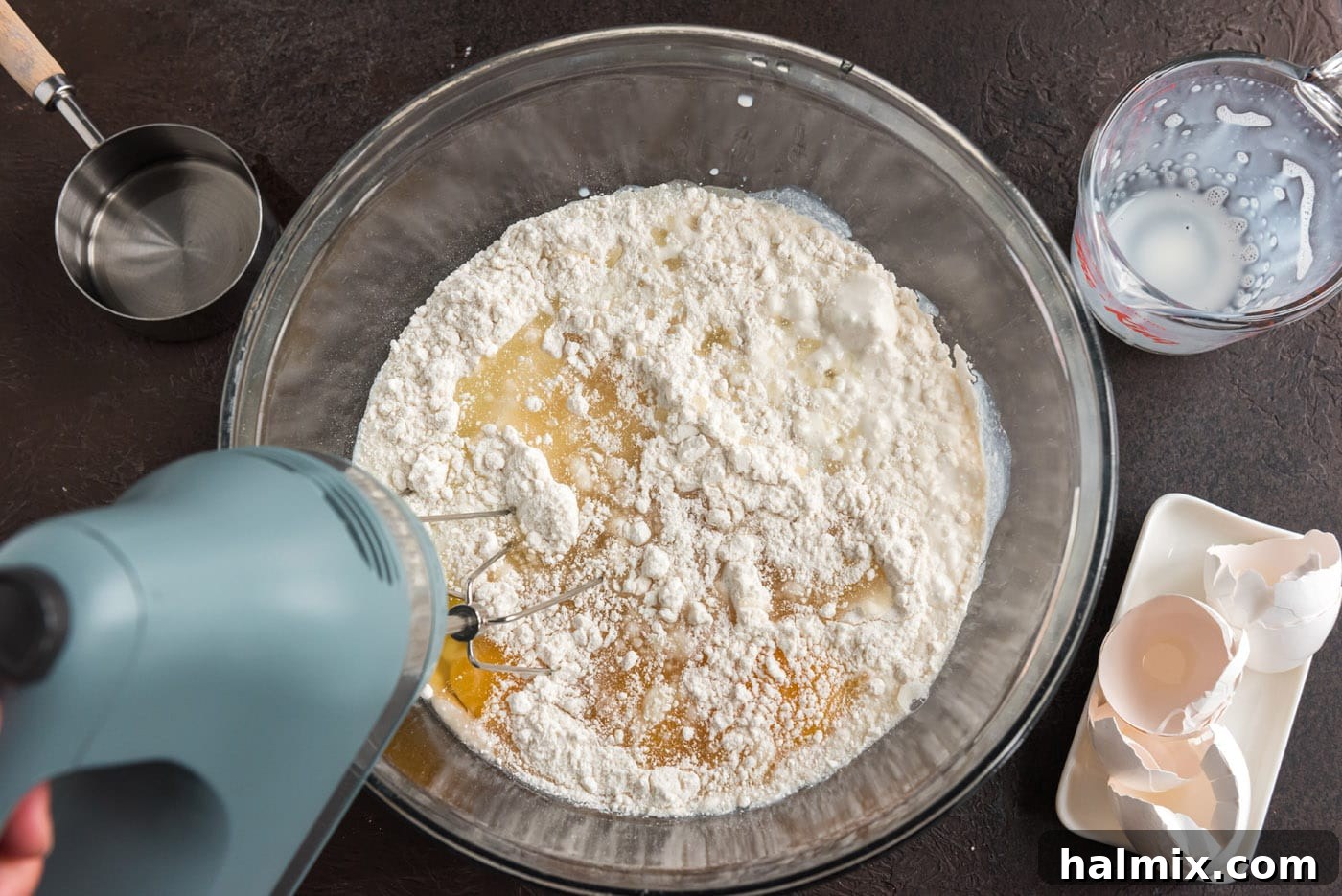 Crimson Raspberry Flip 5 Beating cake batter ingredients in a mixing bowl with an electric mixer