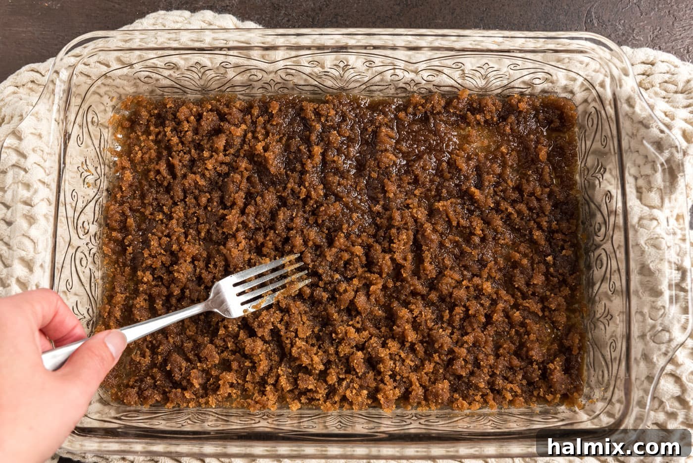 Crimson Raspberry Flip 9 Brown sugar being sprinkled evenly over melted butter in a baking dish