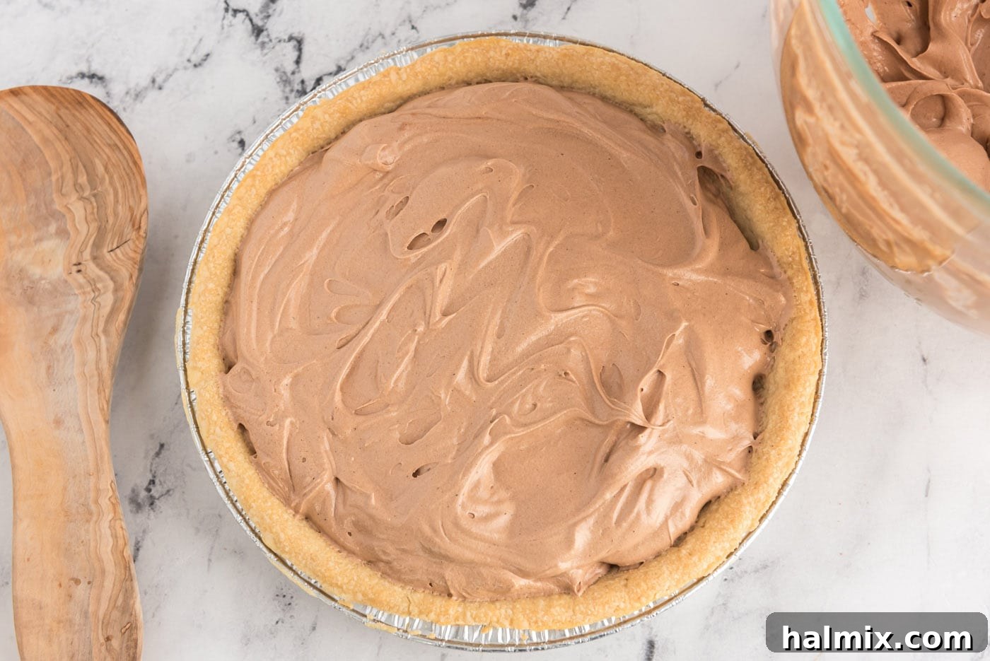 Decadent French Silk Delight 12 An overhead view of the prepared French Silk Pie, with the smooth chocolate filling evenly spread in the baked pie crust.