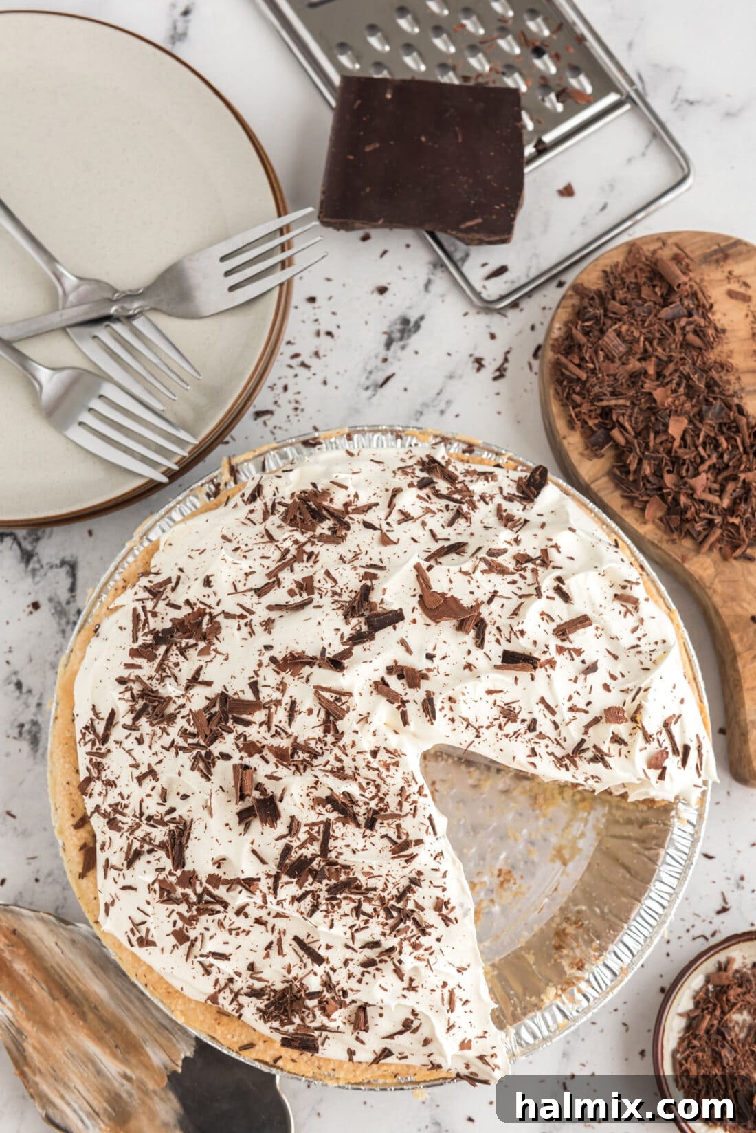 Decadent French Silk Delight 16 An overhead view of a beautifully prepared French Silk Pie, with a single slice already removed, highlighting its perfect creamy texture and elegant presentation.