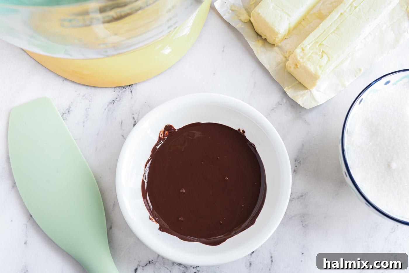 Decadent French Silk Delight 6 Smooth, melted unsweetened chocolate in a bowl, cooled and ready for the next step.