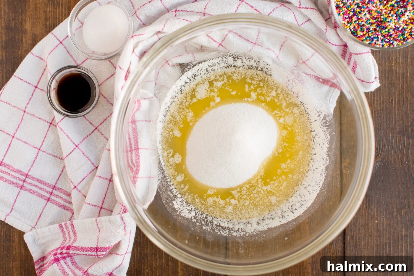 Melted butter and sugar mixture, showing the initial creamy texture for the cookie base.