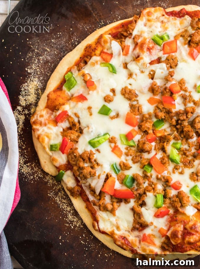 Perfect Homemade Pizza Crust 3 close up of homemade pizza with melted cheese and fresh toppings