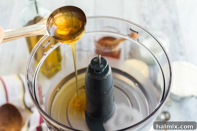 Perfect Homemade Pizza Crust 5 adding honey to food processor