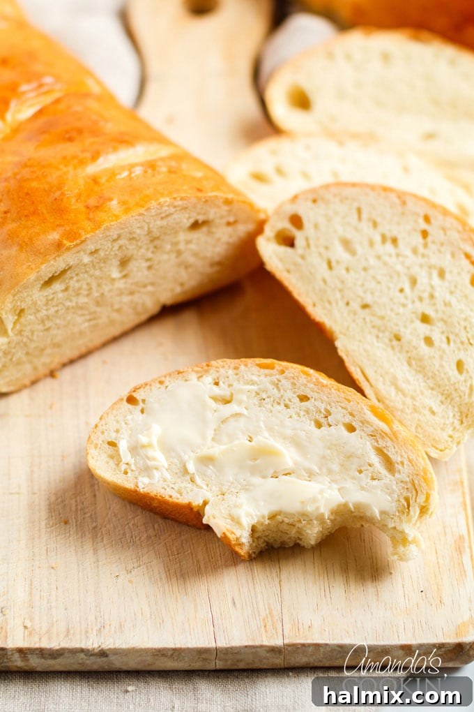 slice of Italian bread with butter and a bite out of it