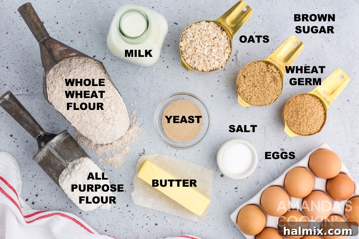 A beautifully arranged selection of labeled ingredients including flour, oats, milk, eggs, and butter, prepared for making multigrain bread.