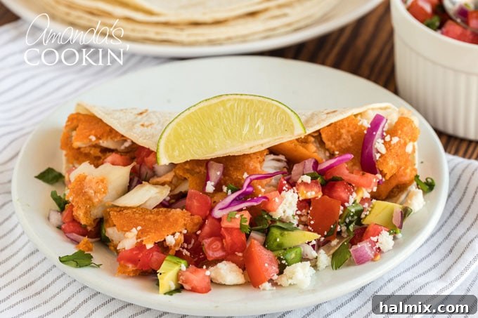 Baja Fish Bites 11 fish taco with toppings on plate