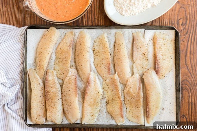 Baja Fish Bites 6 fish strips on paper towels seasoned with salt and pepper