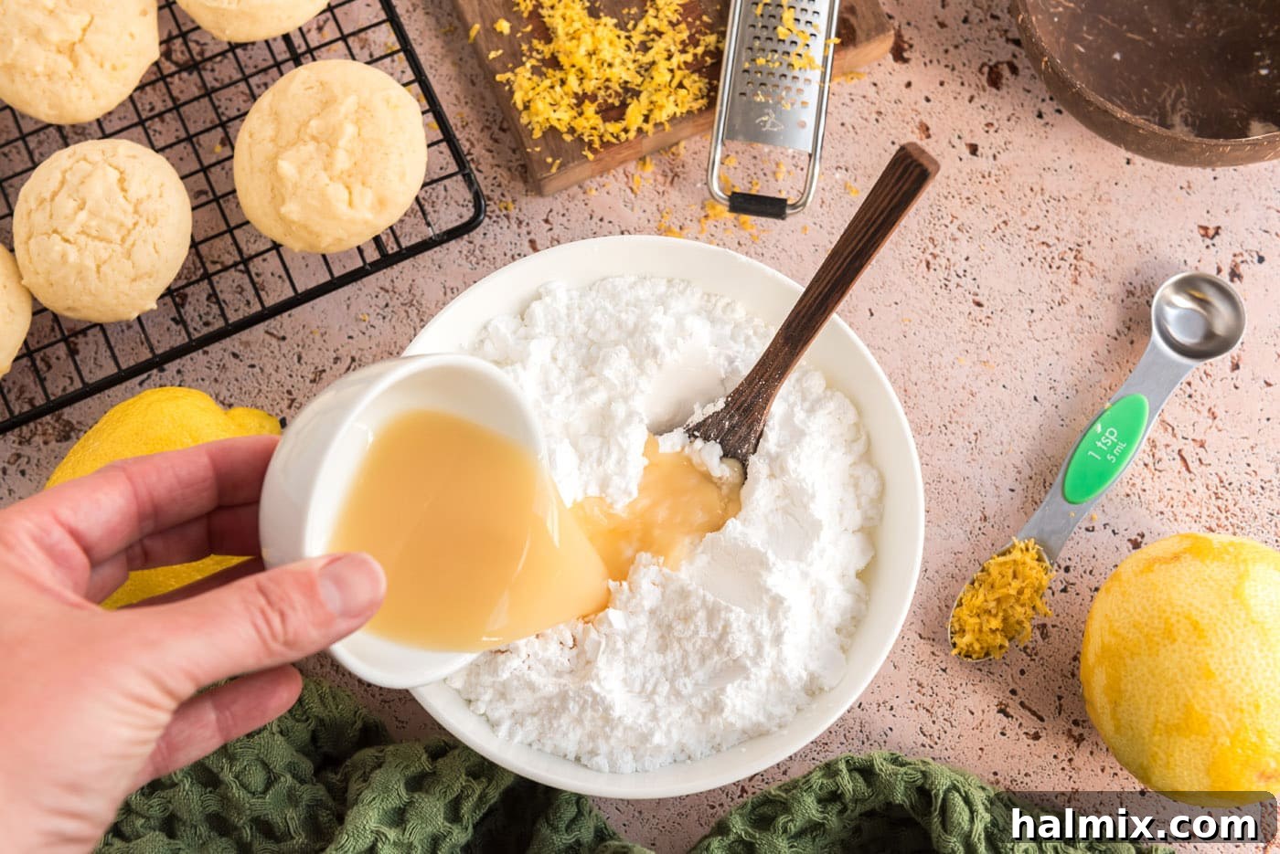 Tangy Lemon Clouds 15 Pouring lemon juice into powdered sugar for the glaze