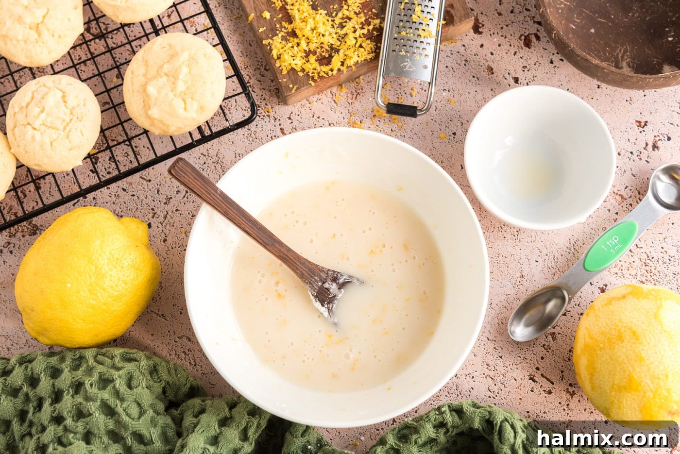 Tangy Lemon Clouds 16 Easy lemon glaze with lemon zest in a small bowl
