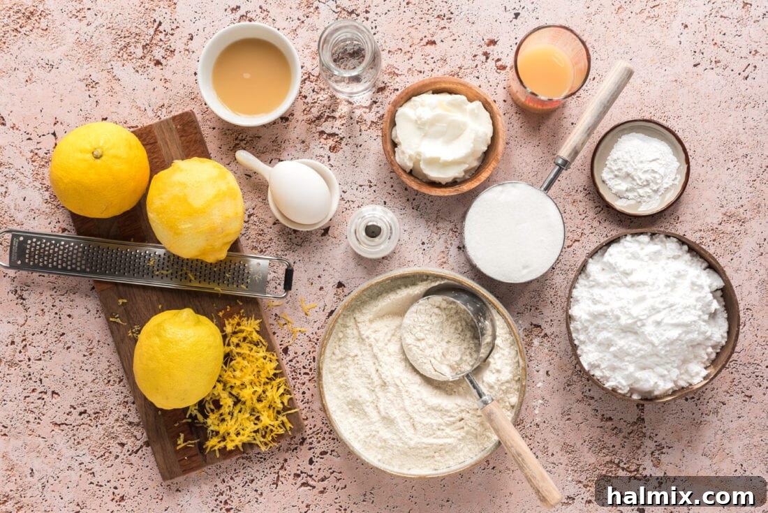 Tangy Lemon Clouds 4 Assorted ingredients for Lemon Drop Cookies laid out on a surface
