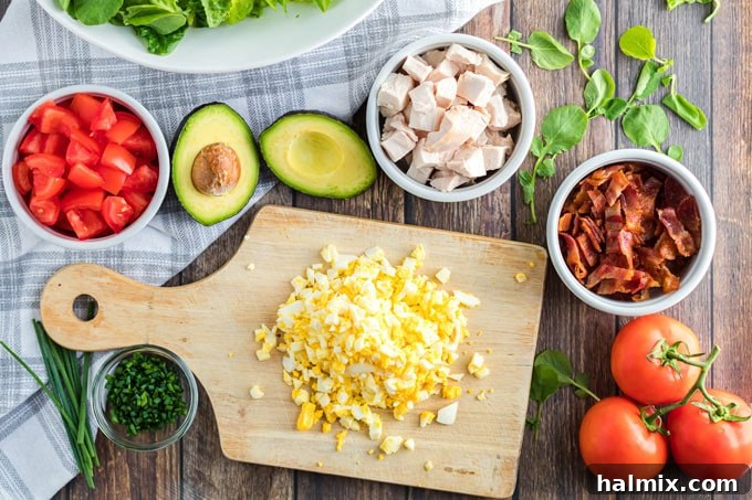 ingredients for cobb salad - a collection of fresh produce, proteins, and cheese
