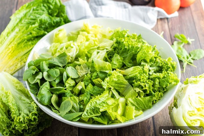 lettuce in a bowl - a mix of fresh greens ready for cobb salad assembly