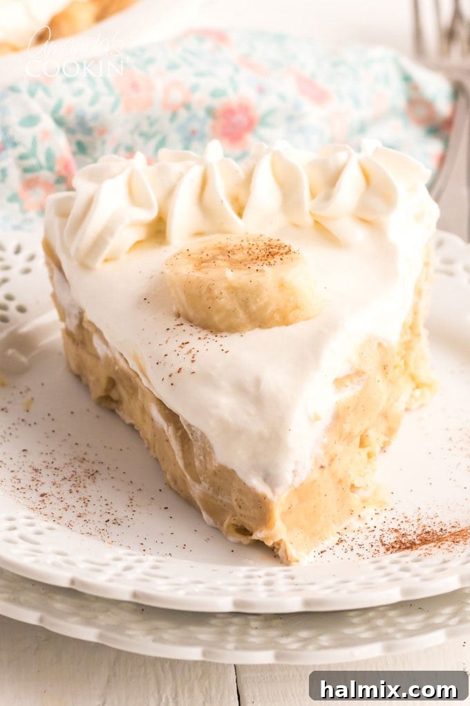slice of banana cream pie on a white plate