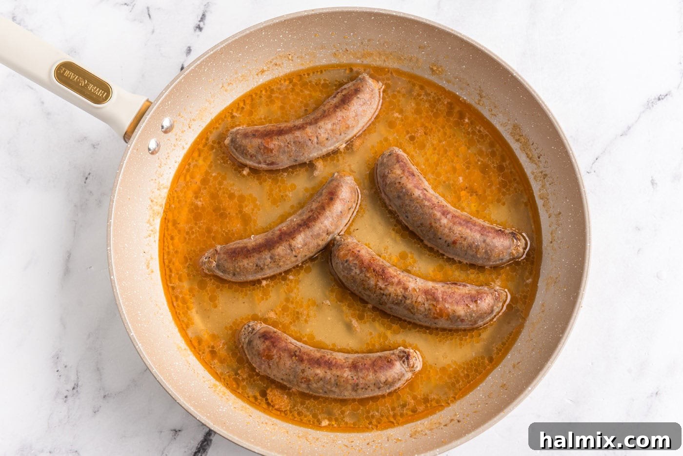 water added to skillet with Italian sausage