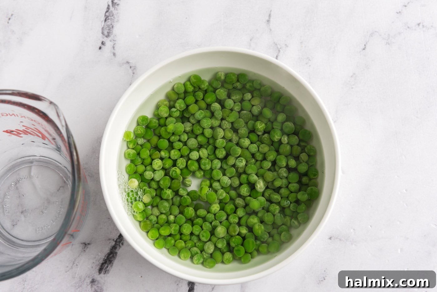 peas in a bowl with hot water