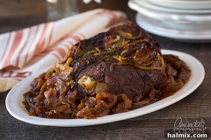 A perfectly cooked, deliciously tender Amish Pot Roast ready to be enjoyed with family and friends.