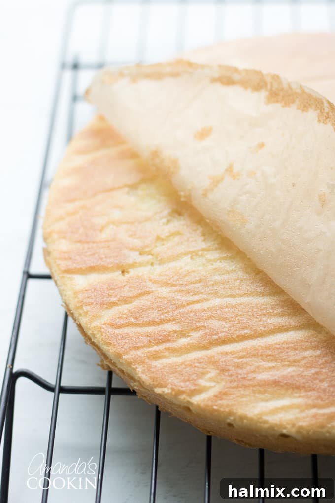 peeling parchment paper off cooled cake layer