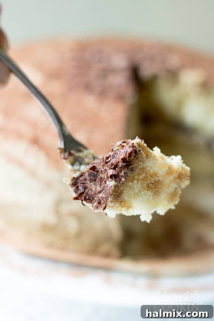fork taking a bite of tiramisu cake
