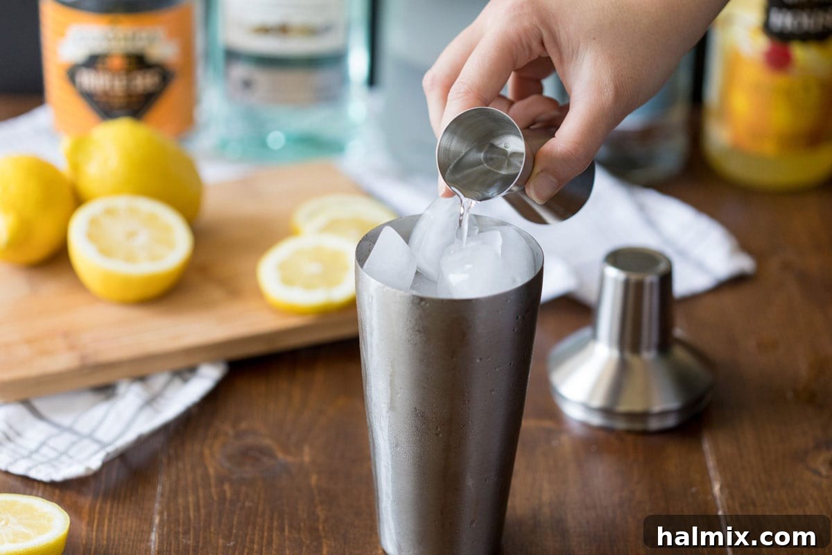 Long Island Iced Tea 4 adding vodka to a cocktail shaker
