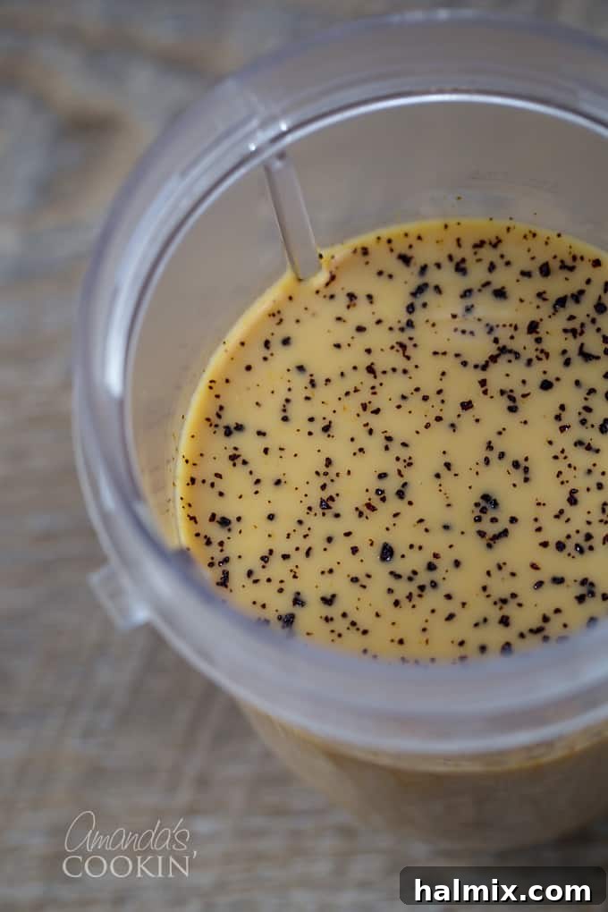 Homemade Mocha Frappe Magic 5 Drizzling chocolate syrup into the blender cup with coffee and milk, preparing the base for a delicious mocha frappuccino.
