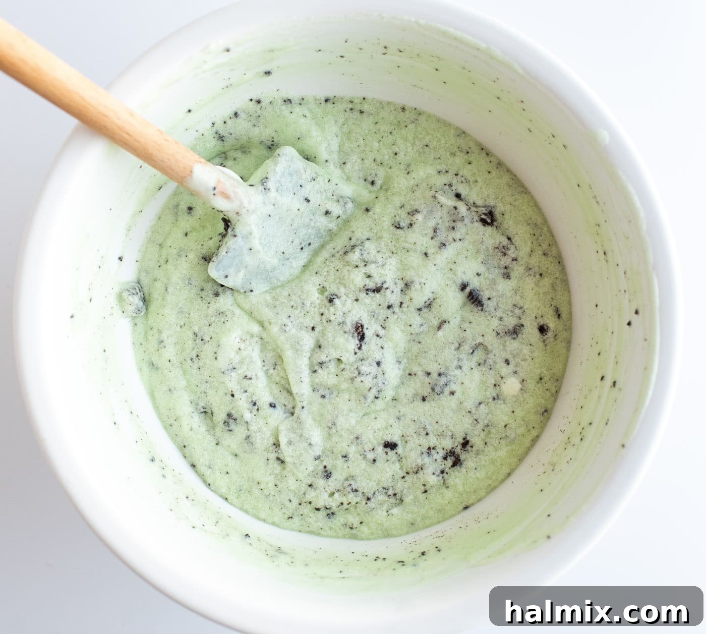 Emerald Mint Delight 9 Crushed Oreo cookies being gently folded into the green, creamy grasshopper pie filling.