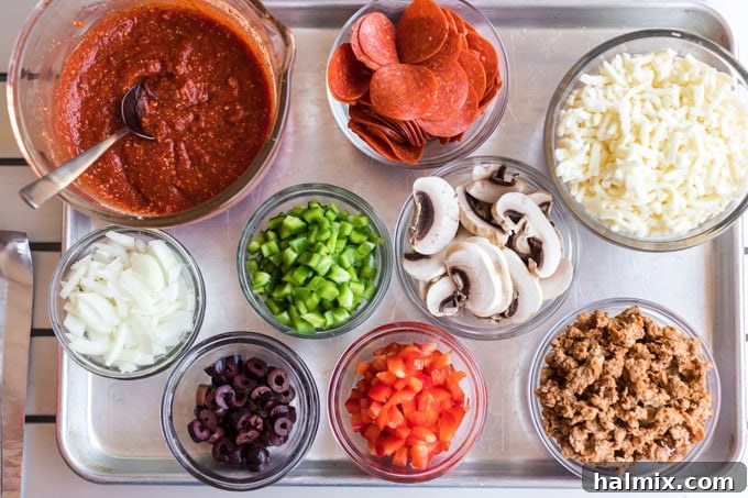 A vibrant selection of fresh ingredients laid out for pizza making, including pepperoni, bell peppers, onions, mushrooms, olives, and mozzarella cheese.