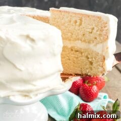 slice of white cake being removed with spatula