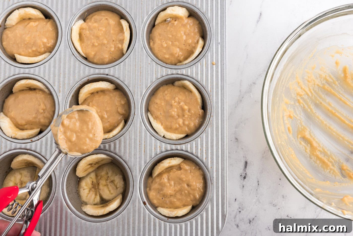adding muffin ingredients to banana lined muffin pan