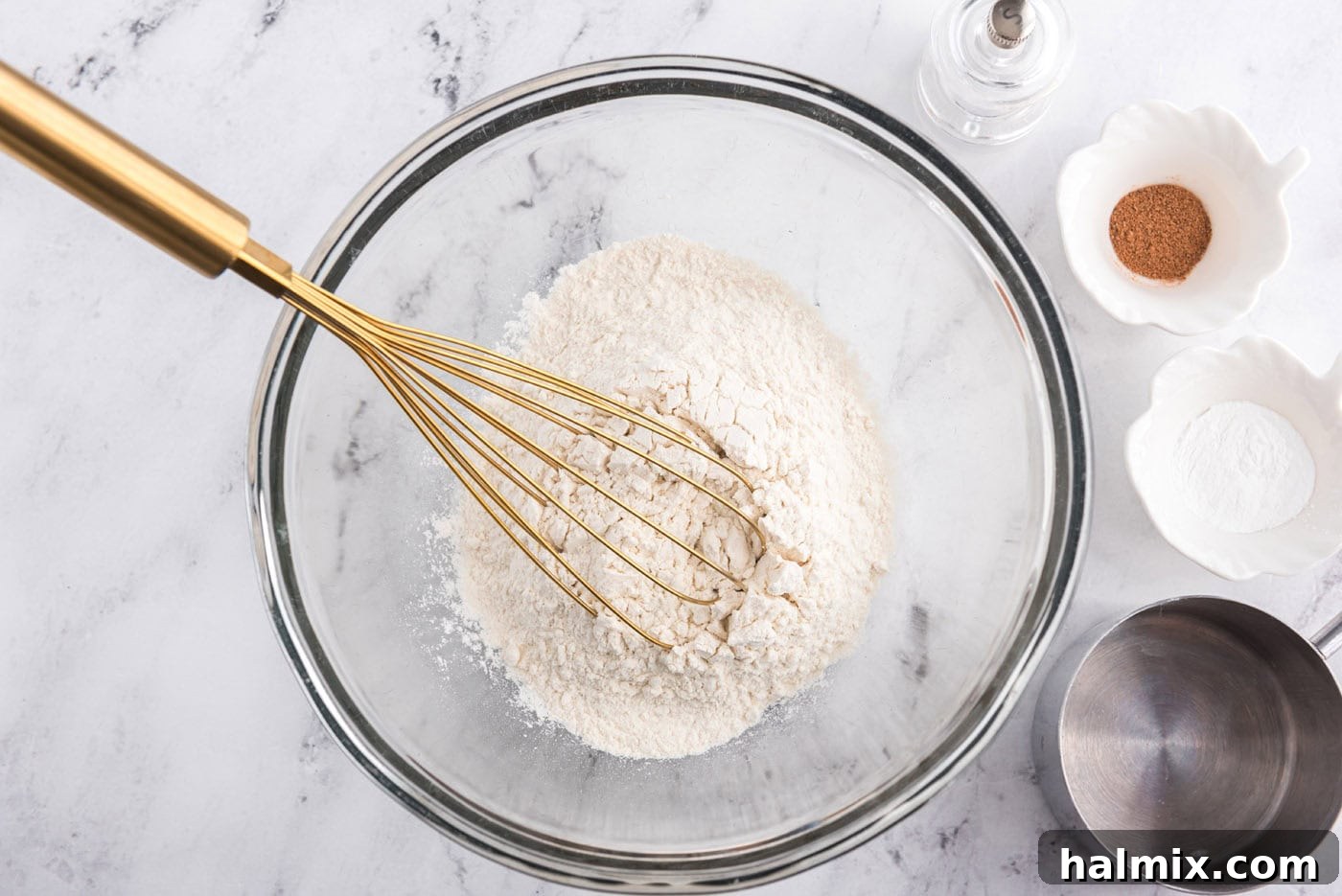 flour and dry ingredients with a whisk in a bowl