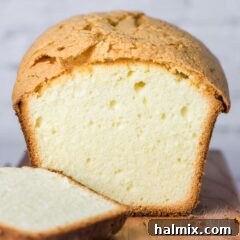 Velvet Pound Cake 2 A beautifully sliced pound cake, showcasing its tender, golden interior.