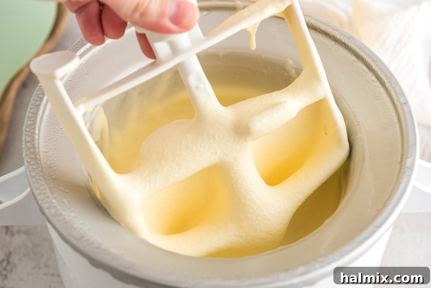 Ice cream maker paddle being lifted out of the ice cream maker to show texture