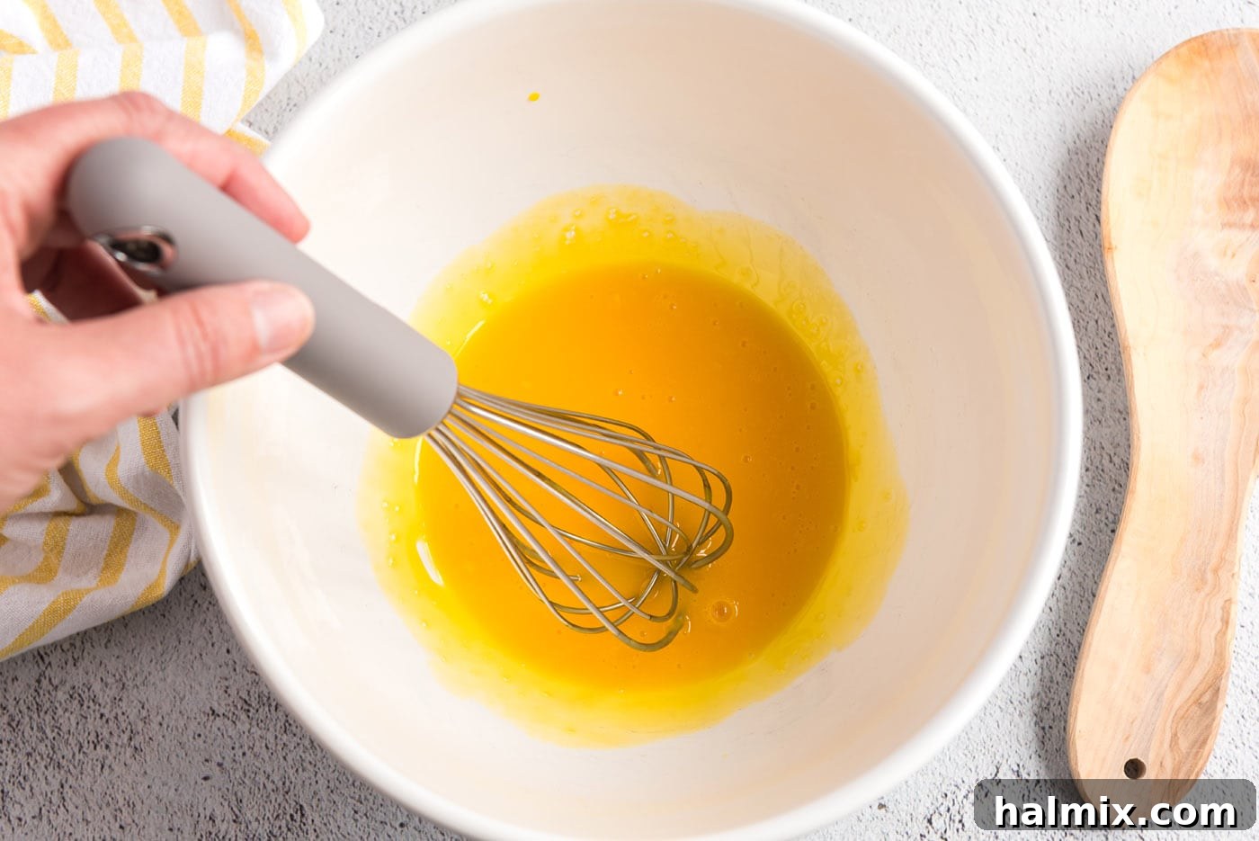 Whisked egg yolks in a bowl
