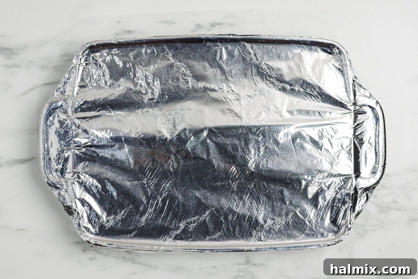 Tender Beef Brisket with Rich Gravy 7 pan covered in foil