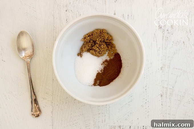 Cinnamon Sugar Topping for Zucchini Bread A small bowl containing brown sugar, white sugar, and cinnamon, prepared for the topping.